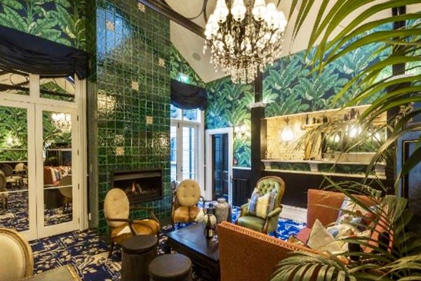Inspiration for a Victorian Open Concept living room With a Library, Green Walls, Carpet, a Standard Fireplace, a Metal Fireplace Surround, No TV and Blue Floor.