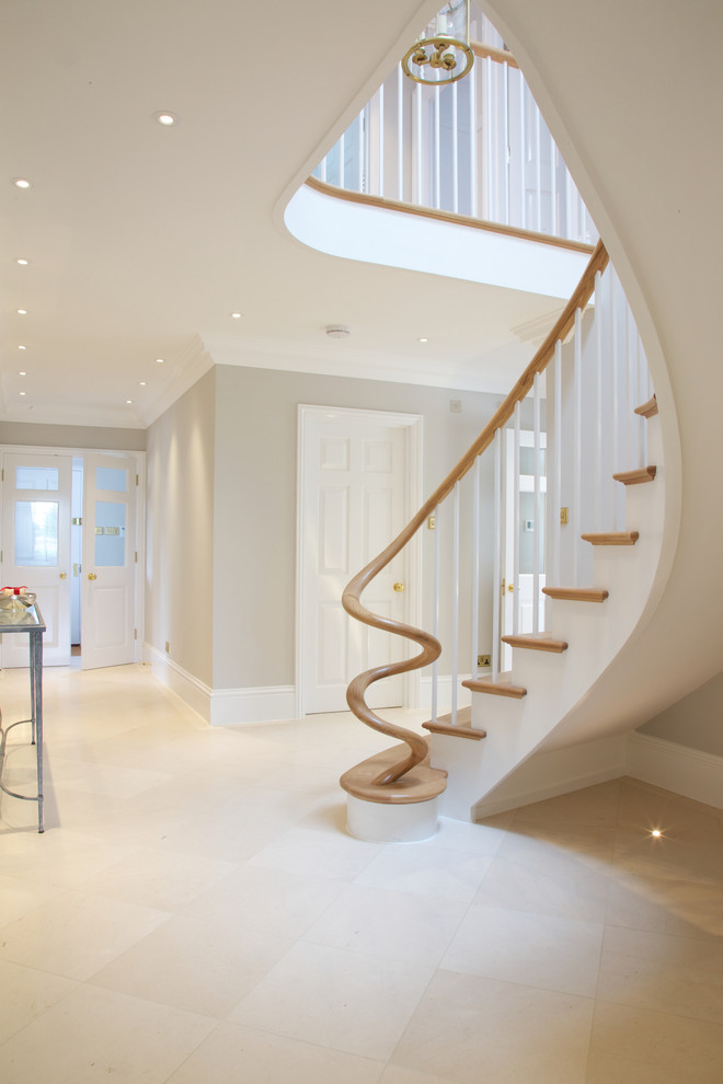 This is an example of a contemporary entryway in Wiltshire with limestone floors.