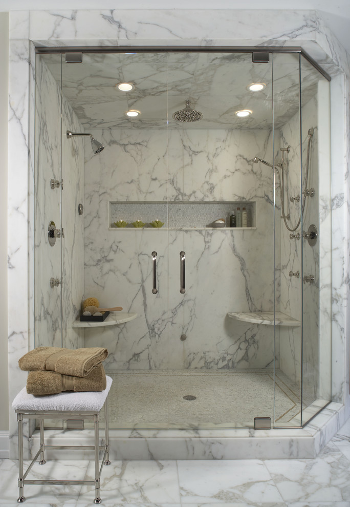 Photo of a contemporary bathroom in Detroit with an alcove shower, white tile and marble.