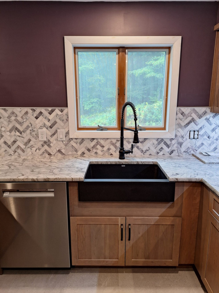 Inspiration for a large transitional u-shaped porcelain tile and gray floor eat-in kitchen remodel in Boston with a farmhouse sink, shaker cabinets, medium tone wood cabinets, granite countertops, gray backsplash, marble backsplash, stainless steel appliances, a peninsula and gray countertops