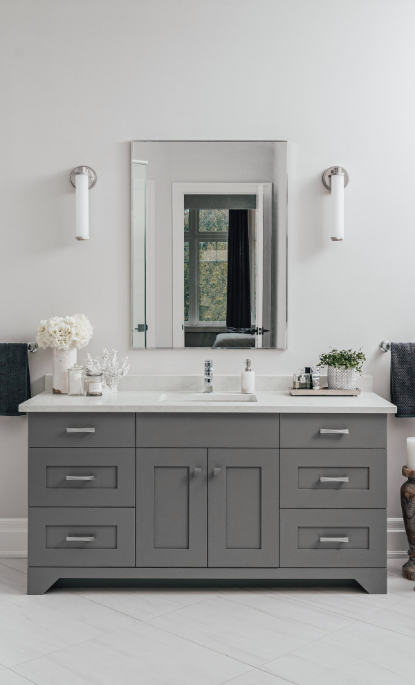 Example of a transitional porcelain tile and single-sink bathroom design in Other with gray cabinets, an undermount sink and quartz countertops