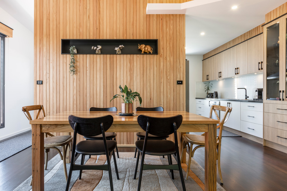 Example of a trendy dining room design in Melbourne