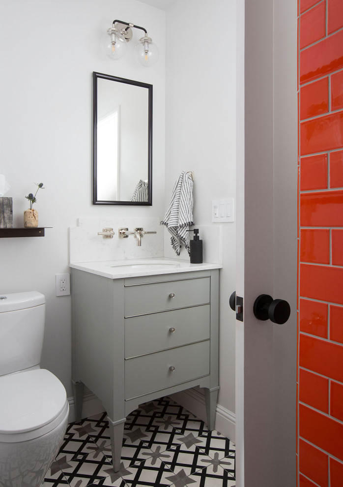 Photo of a mid-sized transitional bathroom in San Francisco with flat-panel cabinets, grey cabinets, an alcove shower, a two-piece toilet, orange tile, ceramic tile, grey walls, ceramic floors, an undermount sink, marble benchtops, multi-coloured floor, an open shower, white benchtops, a single vanity and a freestanding vanity.