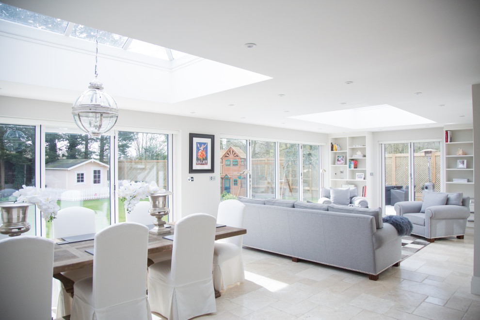 Photo of a large modern open concept living room in Berkshire with grey walls, limestone floors and beige floor.