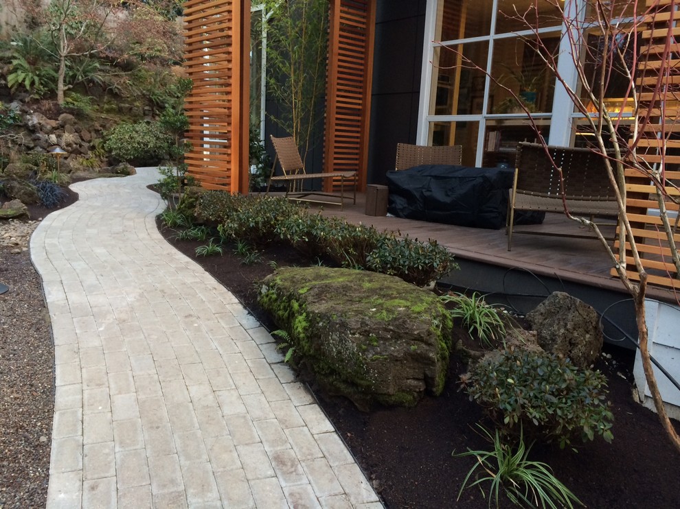 Design ideas for a small asian front yard concrete paver garden path in Portland.