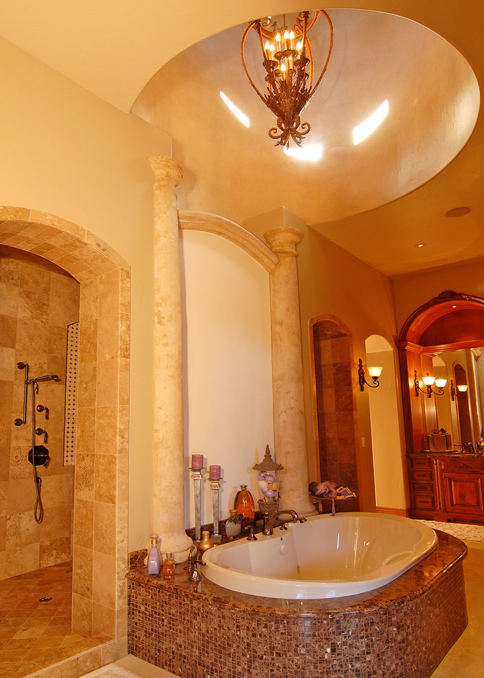 Inspiration for an expansive traditional master wet room bathroom in Other with raised-panel cabinets, dark wood cabinets, a drop-in tub, beige tile, travertine, beige walls, limestone floors, beige floor and an open shower.
