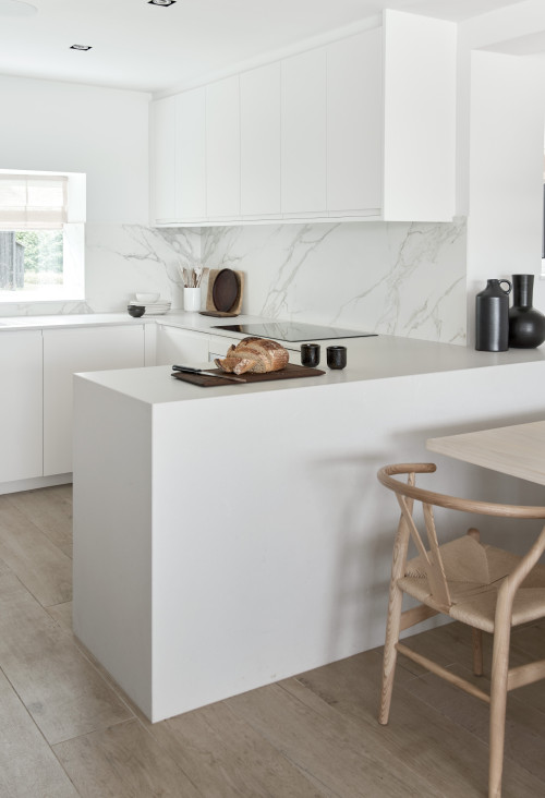 Discover Elegant Design with Minimalist Kitchen Designs: U-Shaped Layout Featuring a Marble-Look Quartz Backsplash