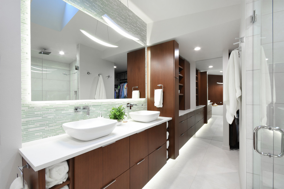 Large contemporary master bathroom in Seattle with flat-panel cabinets, dark wood cabinets, a freestanding tub, a double shower, a one-piece toilet, white tile, porcelain tile, white walls, porcelain floors, a vessel sink, engineered quartz benchtops, white floor, a hinged shower door, white benchtops, a niche, a double vanity, a built-in vanity and wood walls.