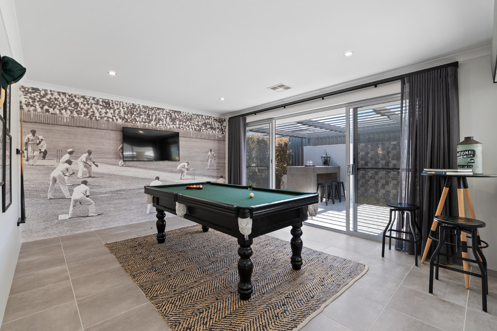 Photo of a contemporary enclosed family room in Perth with a game room, grey walls, a wall-mounted tv and beige floor.