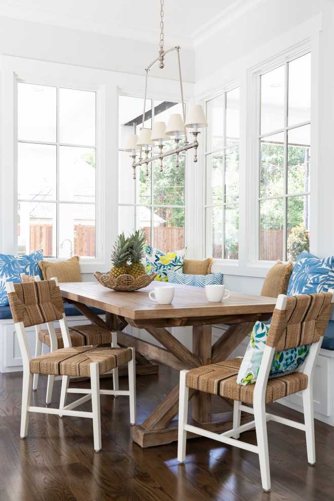 Inspiration for a large beach style dining room in Dallas with dark hardwood floors, brown floor and white walls.