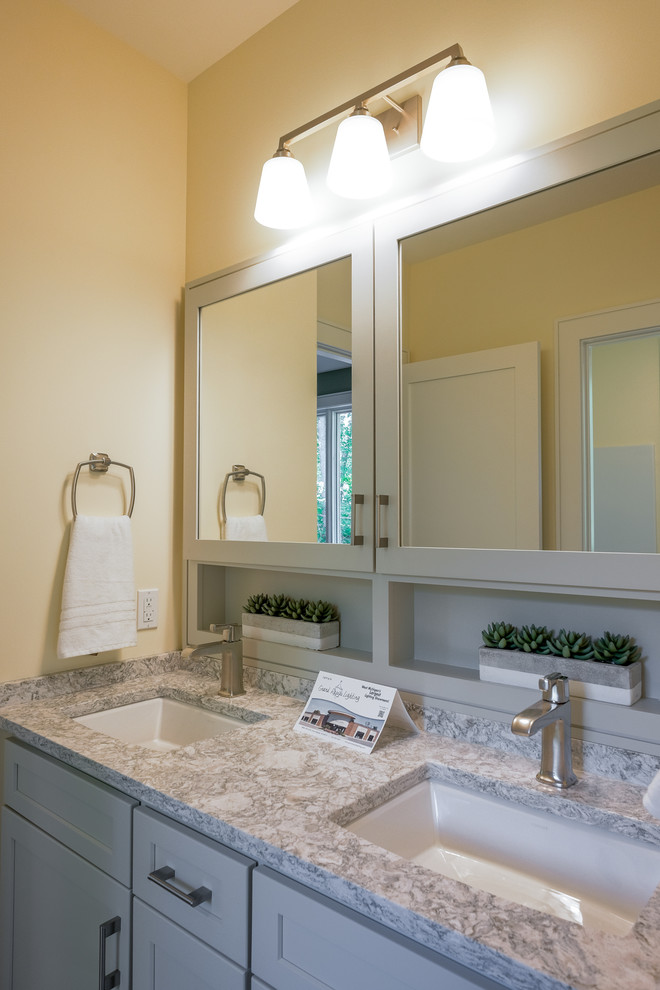 Design ideas for a large arts and crafts master bathroom in Grand Rapids with shaker cabinets, white cabinets, beige walls, an undermount sink and granite benchtops.