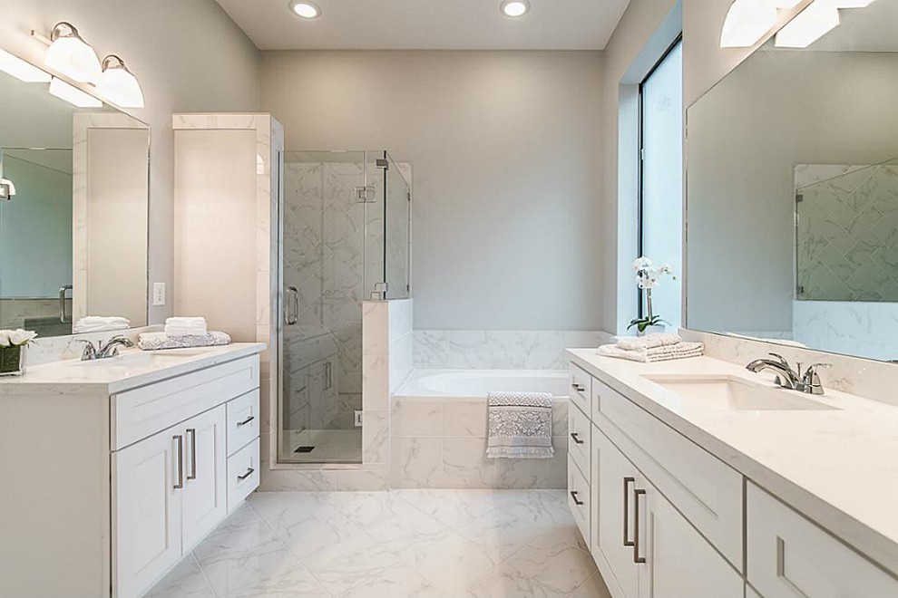 Design ideas for a small transitional 3/4 bathroom in Houston with shaker cabinets, white cabinets, a hot tub, a corner shower, a one-piece toilet, white tile, stone tile, grey walls, marble floors, an undermount sink and engineered quartz benchtops.