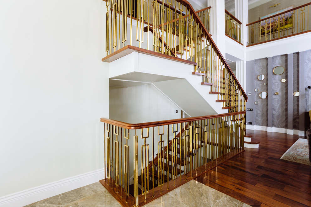 Inspiration for a large transitional wood staircase in Other with wood risers and metal railing.