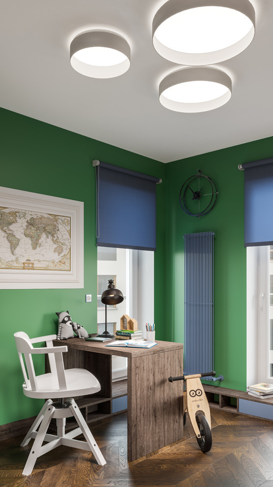 Inspiration for a transitional kids' study room for kids 4-10 years old and boys in Miami with green walls, painted wood floors and brown floor.