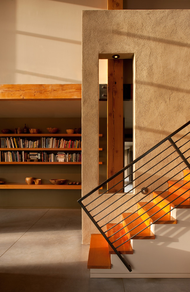 Inspiration for a contemporary wood straight staircase in Atlanta with wood risers.