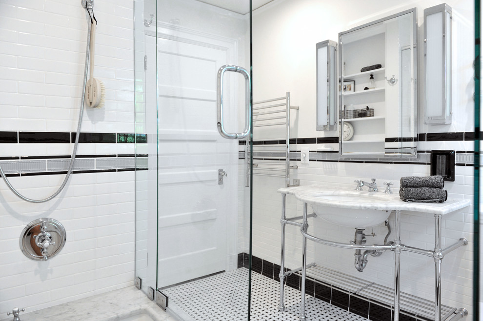 This is an example of a mid-sized traditional master bathroom in Providence with marble benchtops, a shower/bathtub combo, white tile, white walls, a console sink, recessed-panel cabinets, white cabinets, subway tile and white benchtops.