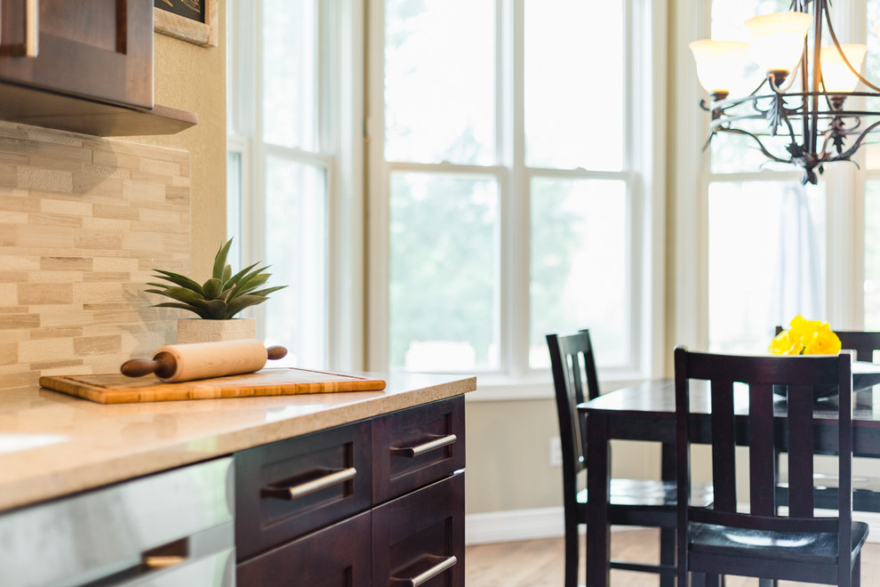 Example of a transitional home design design in Denver