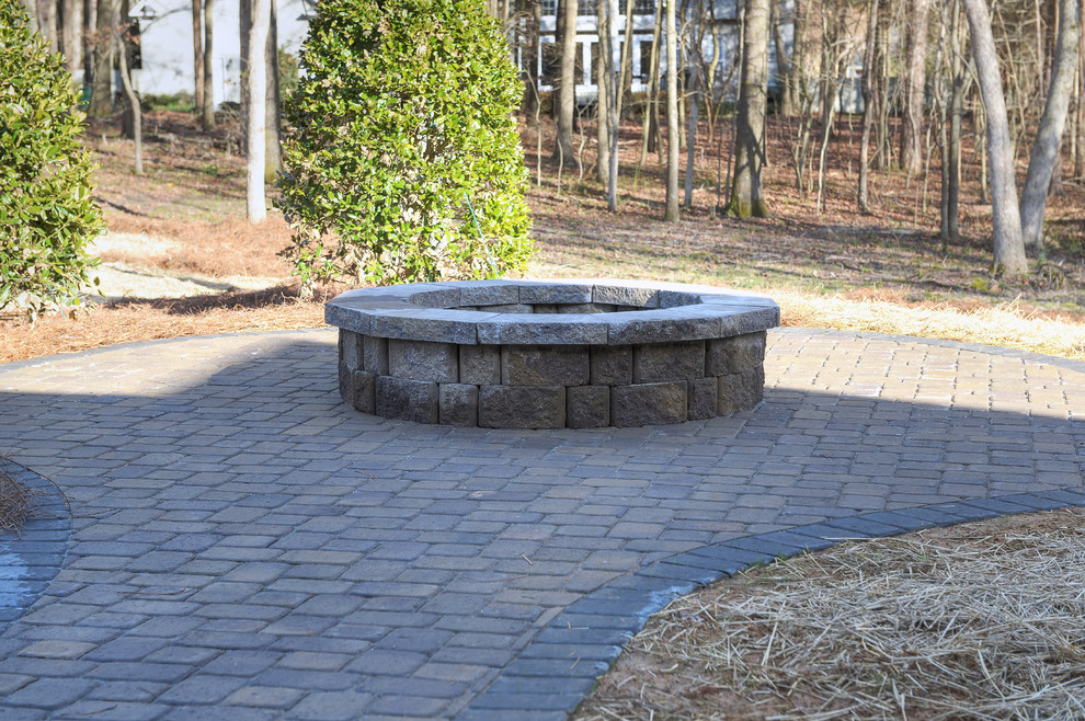 Photo of a mid-sized patio in Charlotte with concrete pavers.