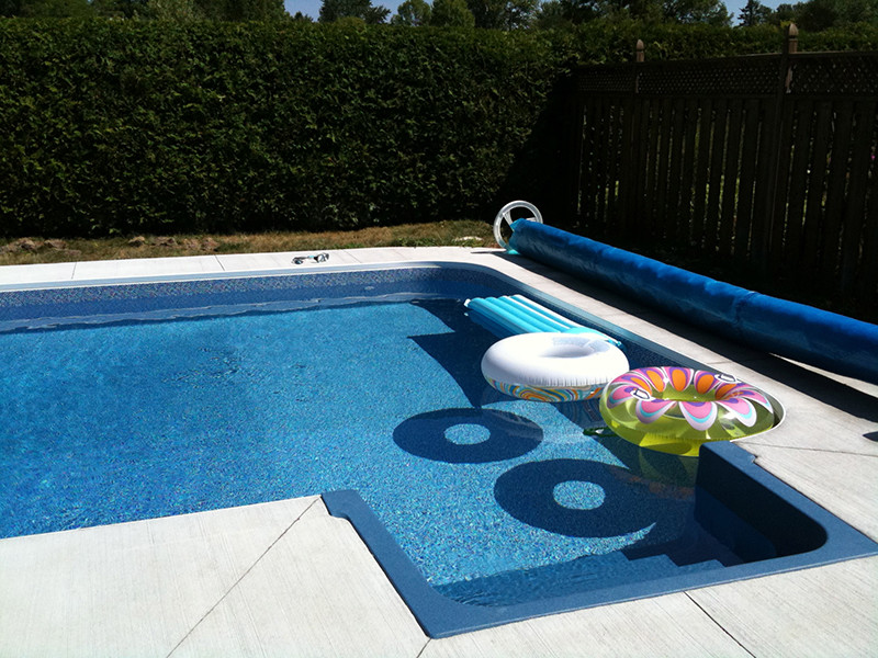 Inspiration for a large timeless backyard stone and custom-shaped natural pool remodel