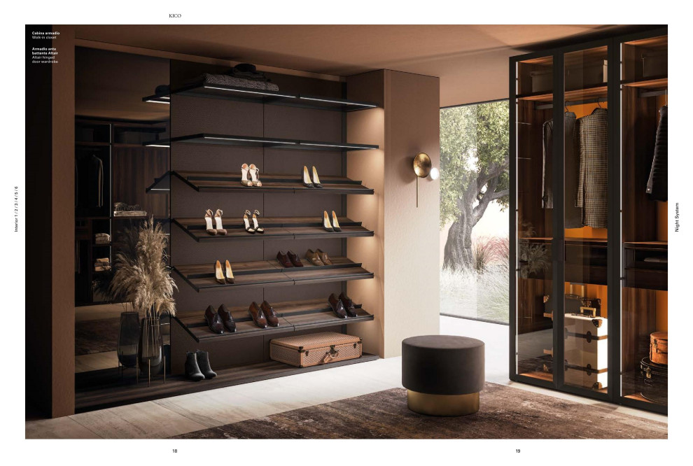Photo of a large modern gender neutral dressing room in Orange County with glass-front cabinets and black cabinets.