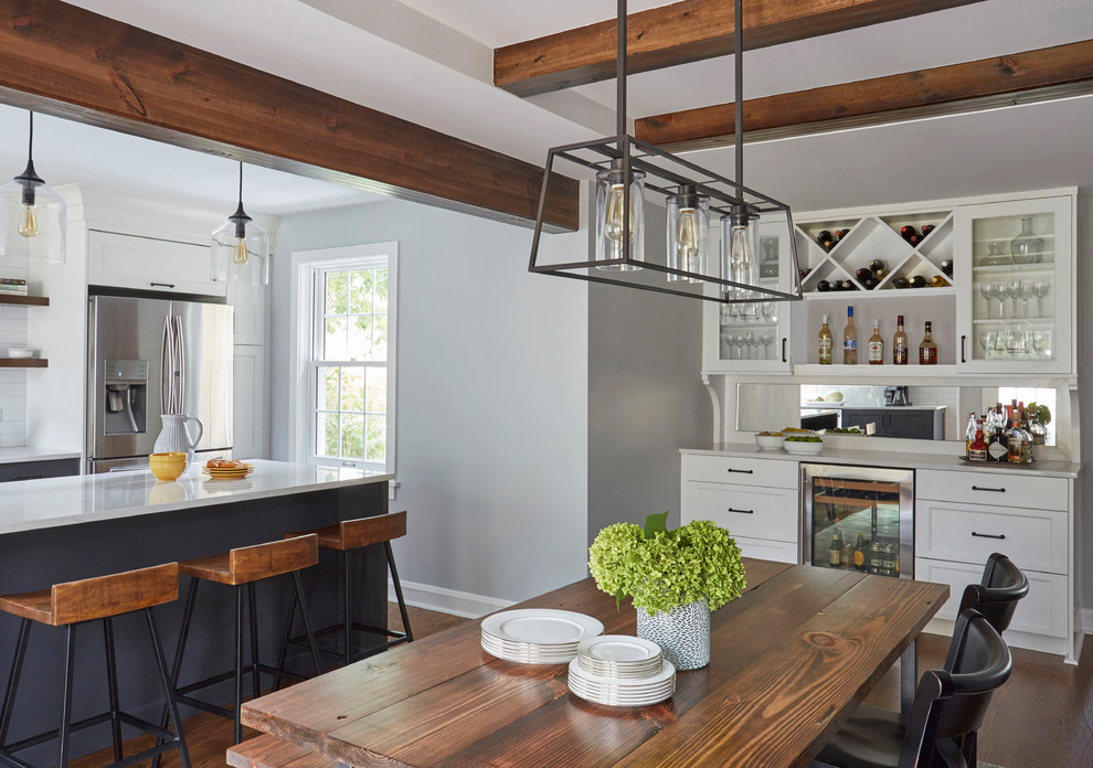 Example of a transitional medium tone wood floor kitchen/dining room combo design in Chicago with gray walls and no fireplace