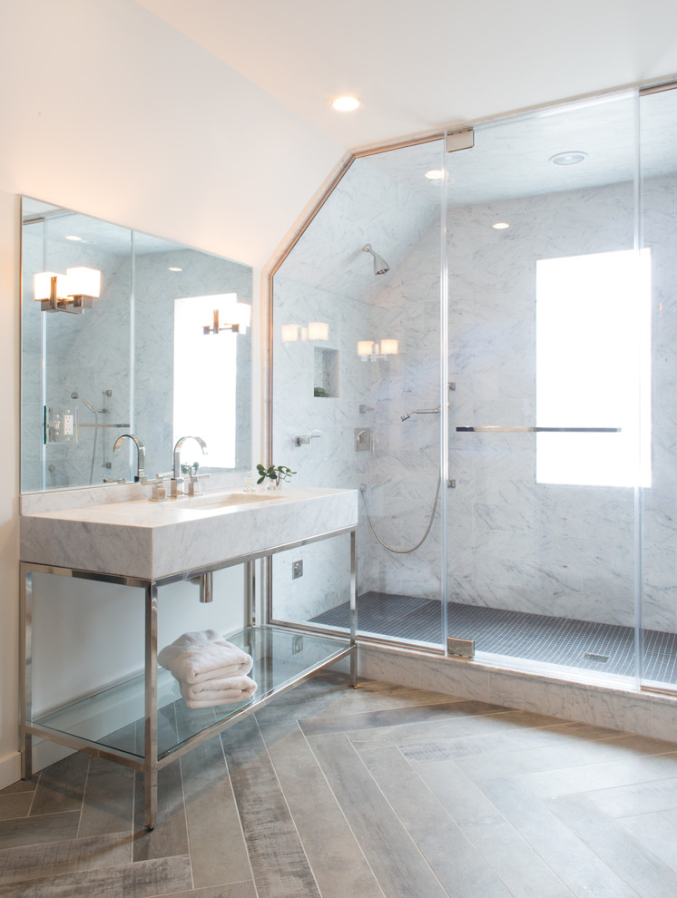 Inspiration for a large transitional master bathroom in New York with a console sink, open cabinets, white cabinets, marble benchtops, a freestanding tub, a double shower, gray tile, marble, white walls, medium hardwood floors, brown floor and a hinged shower door.