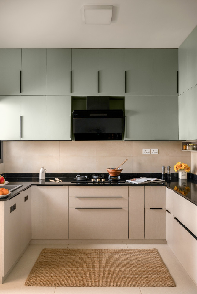 Design ideas for a contemporary U-shaped kitchen in Bengaluru With Flat-panel Cabinets, White Cabinets, Beige Splashback and a Peninsula.