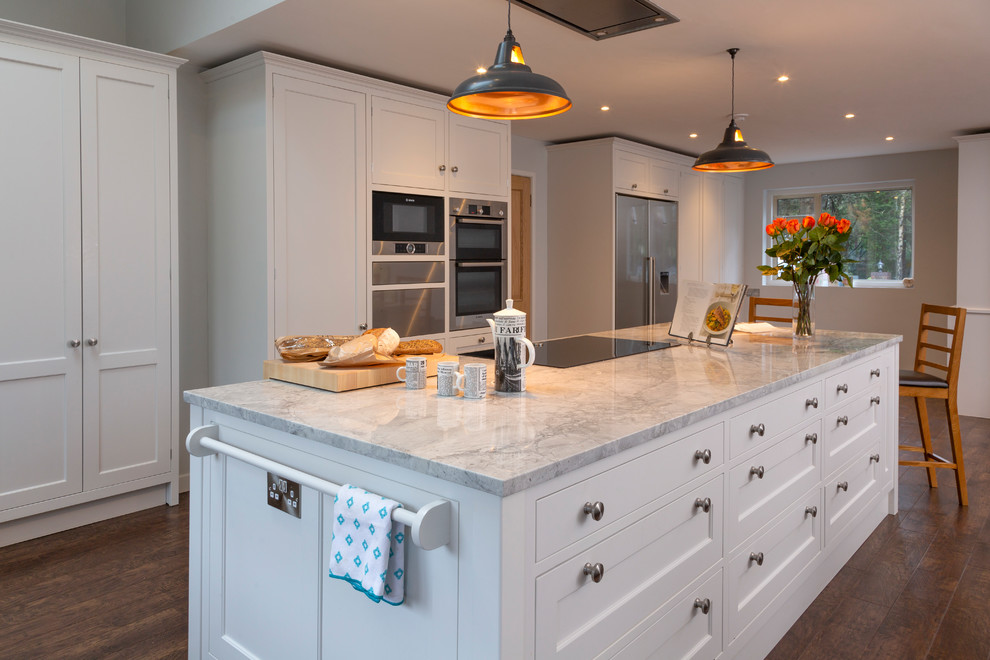 Contemporary kitchen in Surrey with with island.