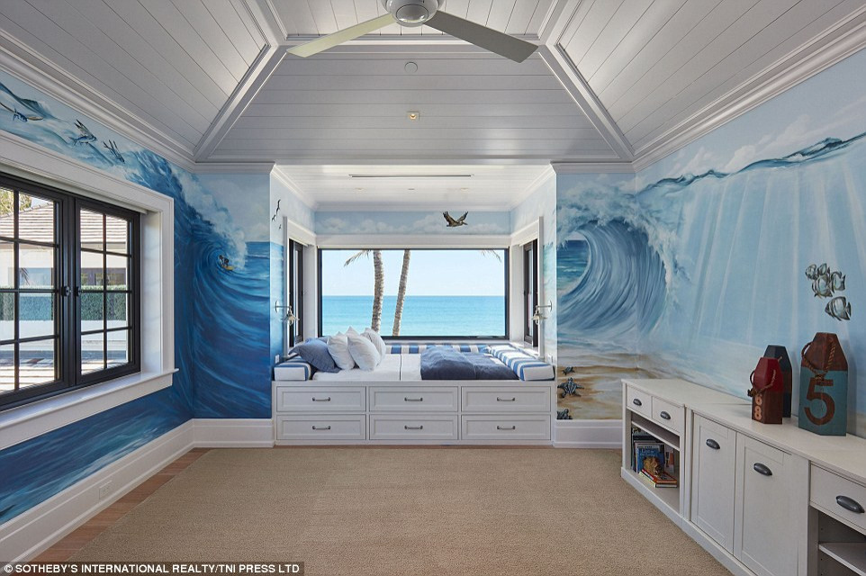 This is an example of an expansive nautical bedroom in Miami with blue walls, light hardwood flooring, beige floors and a vaulted ceiling.