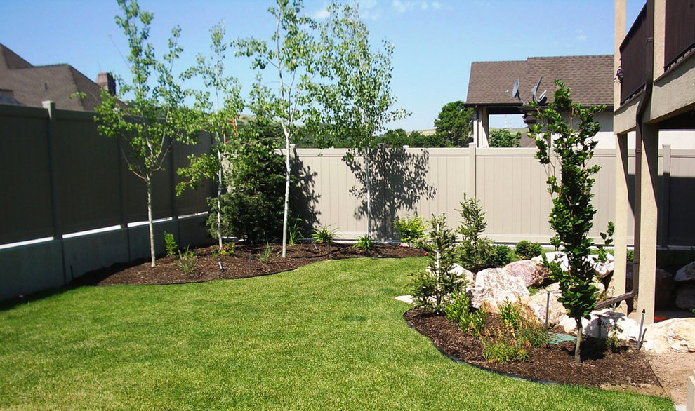 Mid-sized traditional front yard partial sun formal garden in Salt Lake City with natural stone pavers.