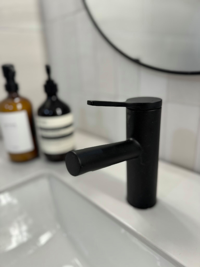 Inspiration for a contemporary powder room remodel in Other