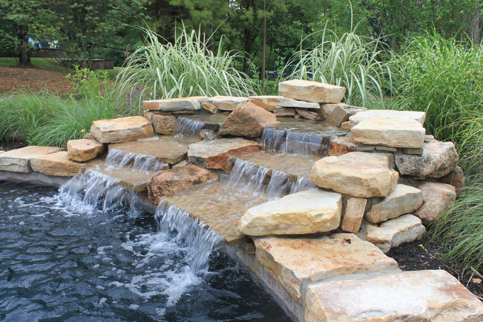 Inspiration for a rustic pool remodel in Boston