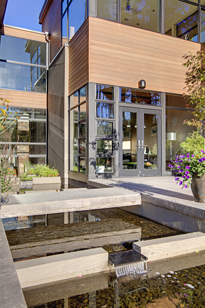 Design ideas for a contemporary exterior in Seattle with wood siding.