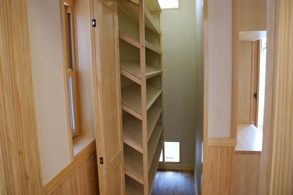 This is an example of an entryway in Other with white walls, medium hardwood floors, a double front door and a light wood front door.