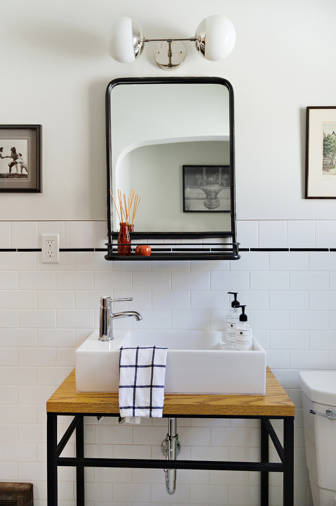 Small transitional master white tile and ceramic tile ceramic tile and white floor alcove bathtub photo with open cabinets, medium tone wood cabinets, a one-piece toilet, gray walls, a vessel sink and wood countertops