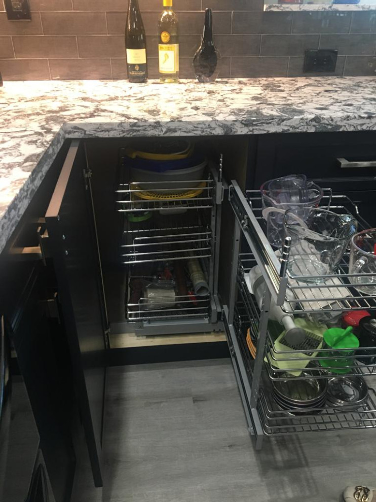 Inspiration for a small transitional u-shaped eat-in kitchen remodel in Miami with an undermount sink, shaker cabinets, quartz countertops, glass tile backsplash and a peninsula