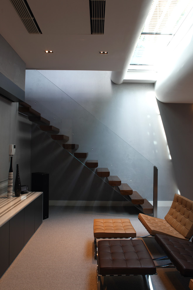 This is an example of a mid-sized contemporary staircase in London.