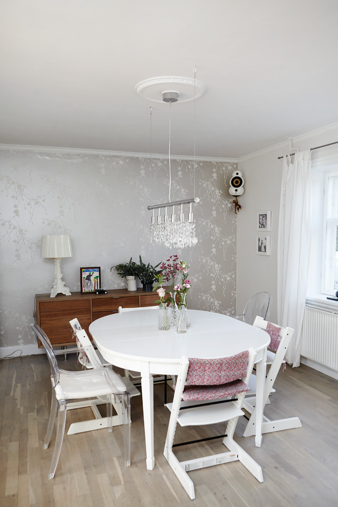 This is an example of a mid-sized scandinavian separate dining room in Wiltshire.