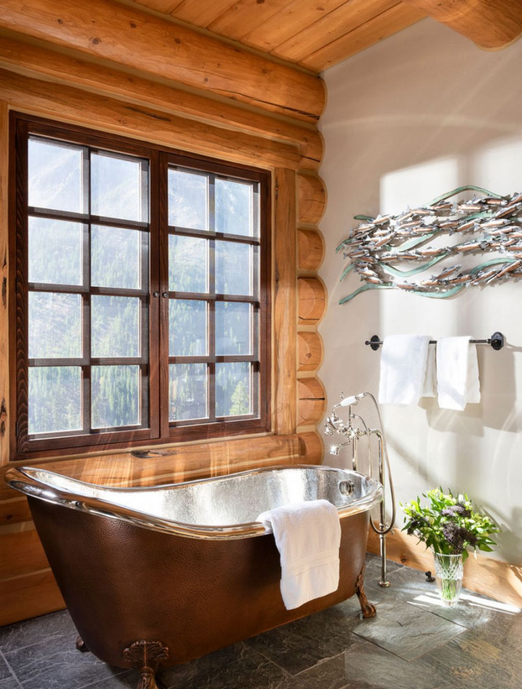 Photo of an expansive modern bathroom in Other with a claw-foot tub and coffered.