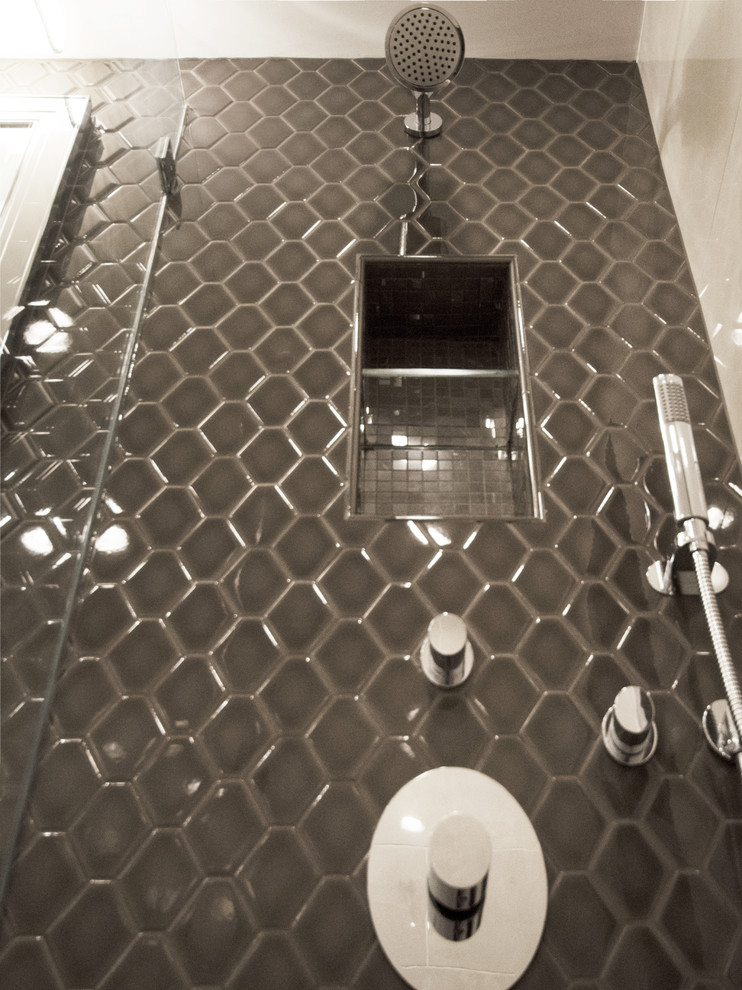 Photo of a small modern bathroom in New York with gray tile, an open shower, grey walls and ceramic tile.
