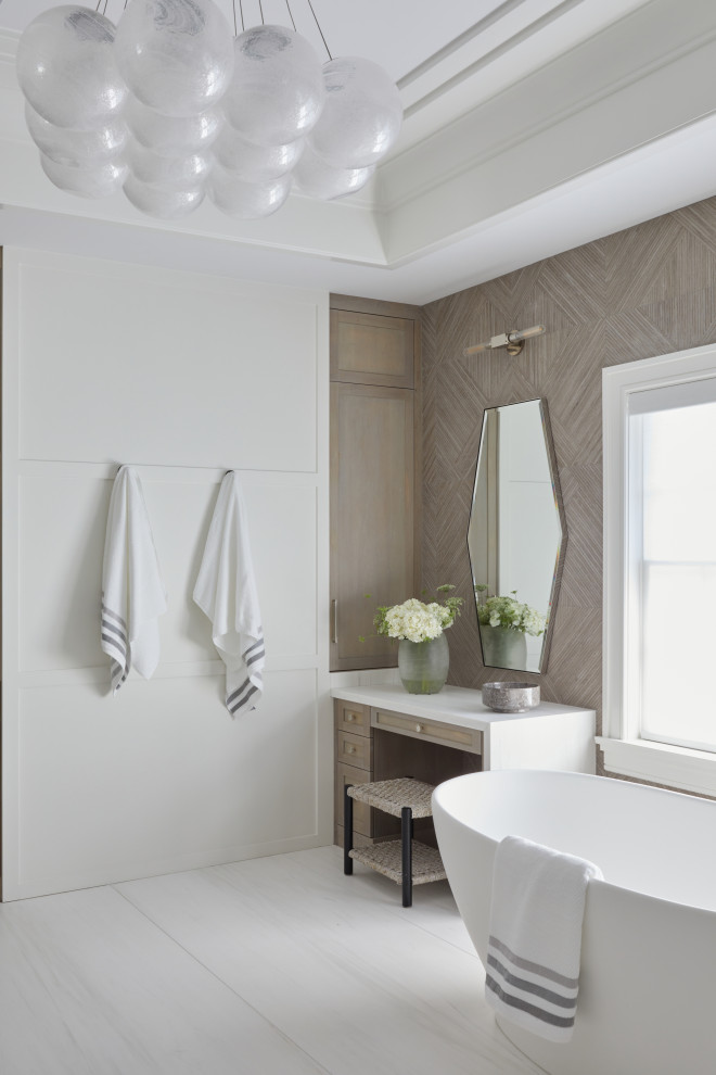 Photo of a large transitional master bathroom in New York with a double vanity, a freestanding vanity, white benchtops, a freestanding tub, white walls, grey floor, a hinged shower door and panelled walls.