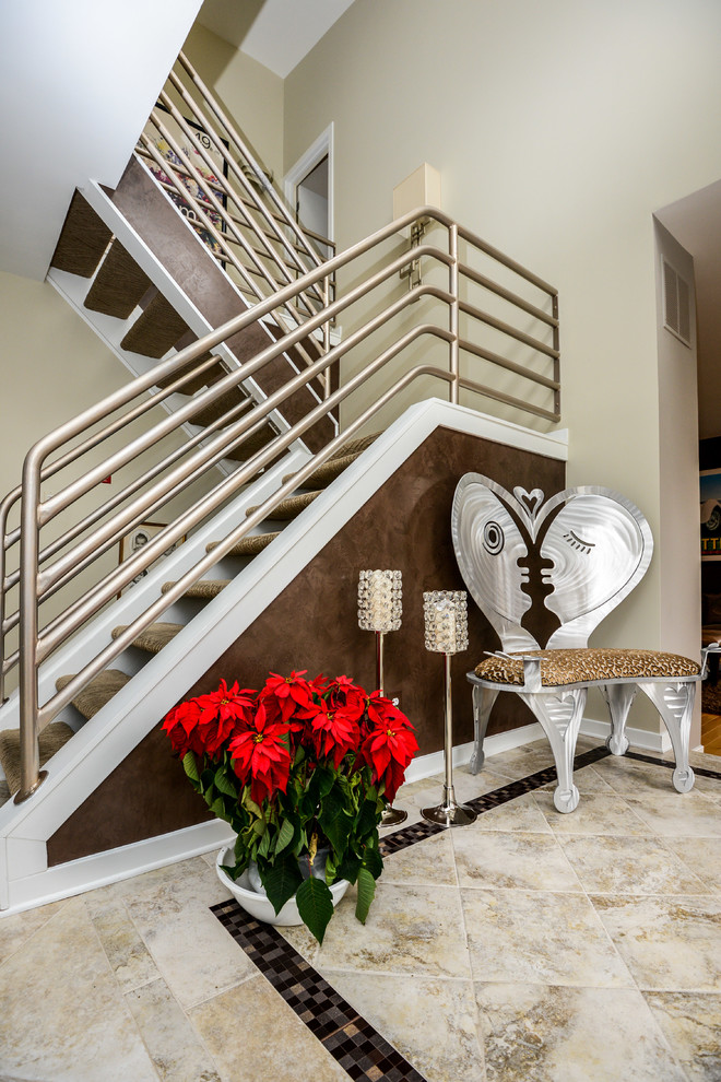 Design ideas for a contemporary staircase in Baltimore with open risers and metal railing.