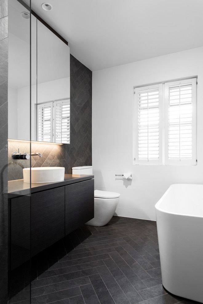 Contemporary master bathroom in Adelaide with a corner shower, gray tile, white walls, grey floor and an open shower.