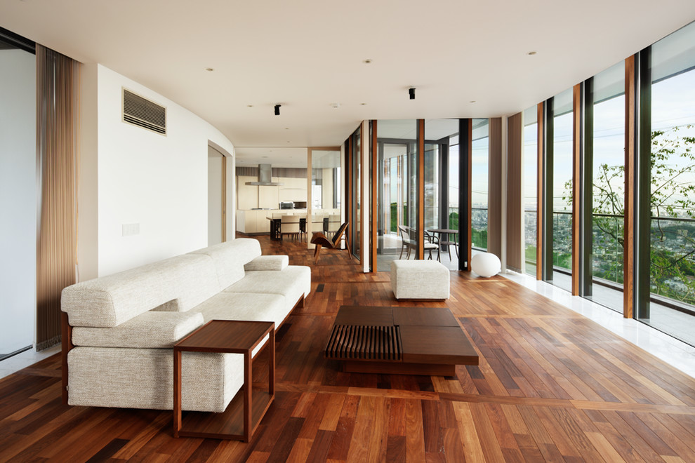 Inspiration for a modern formal open concept living room in Osaka with medium hardwood floors, brown floor and white walls.