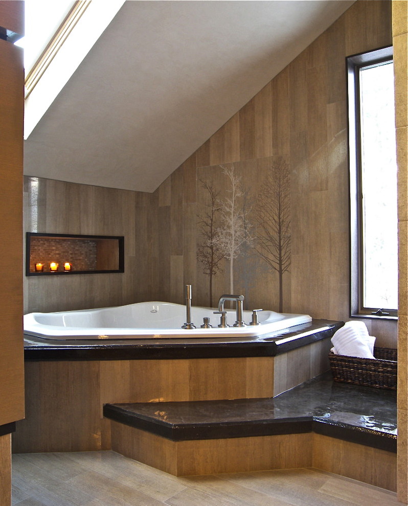 This is an example of an expansive contemporary bathroom in New York with a corner tub, a vessel sink, an alcove shower, a one-piece toilet, beige tile and ceramic tile.