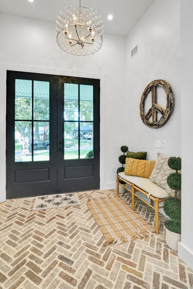 Entry Foyer with Herringbone Brick Floor & Black Double Doors – Home Addition in
