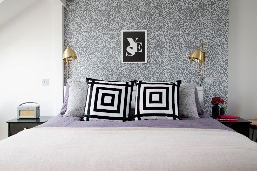 Photo of a mid-sized transitional master bedroom in London with purple walls, carpet and grey floor.