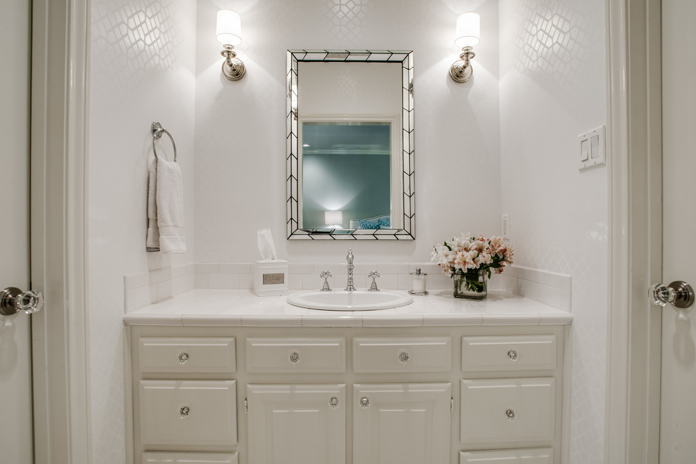 Design ideas for a mid-sized country 3/4 bathroom in Dallas with raised-panel cabinets, white cabinets, ceramic tile, white walls, a drop-in sink and tile benchtops.