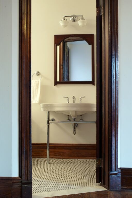 Photo of a mid-sized traditional 3/4 bathroom in New York with white walls, marble floors and a pedestal sink.