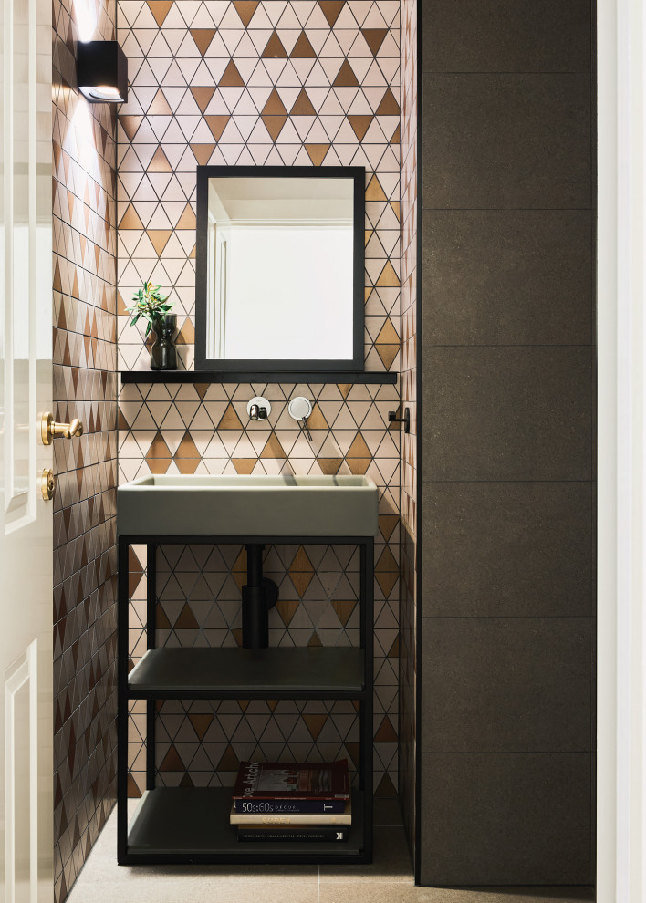 Design ideas for a small contemporary powder room in Melbourne with open cabinets, grey cabinets, multi-coloured tile, mosaic tile, multi-coloured walls, porcelain floors, a pedestal sink, concrete benchtops, grey floor, black benchtops and a freestanding vanity.
